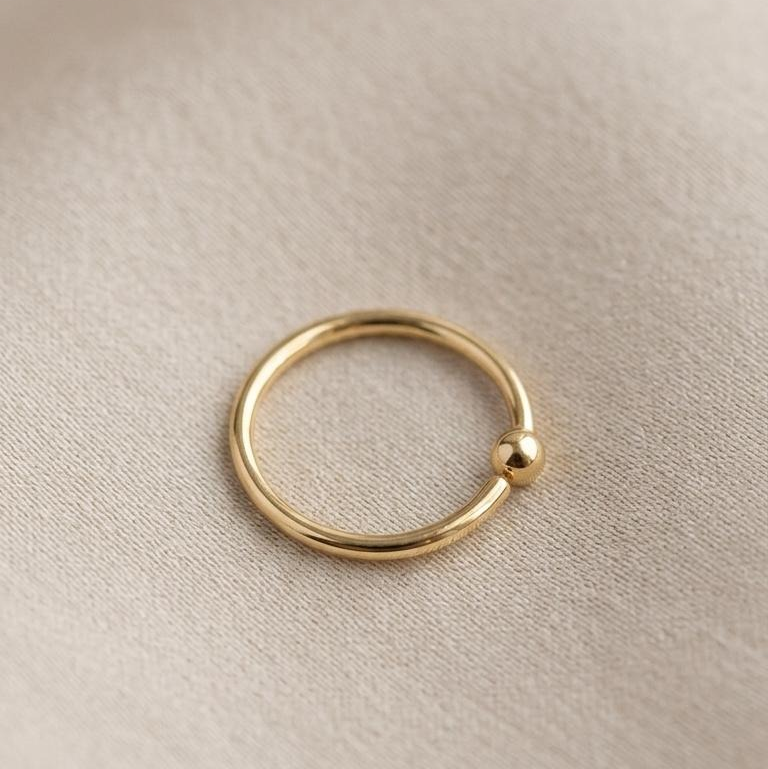 Piercing para nariz de oro 10K tipo aro liso con detalle de balín