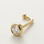 Piercing para nariz de oro 10K curvo con piedra transparente engastada en bisel